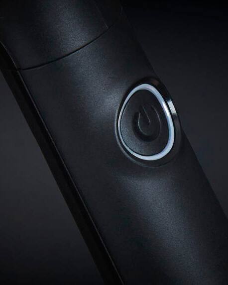 botón para encender el cepillo eléctrico de ghd