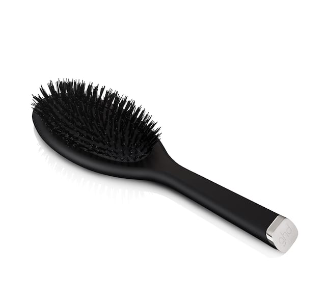 Oval dressing brush