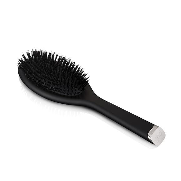 Oval dressing brush