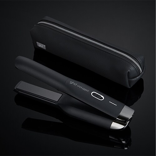 ghd unplugged cordless styler in black with bag